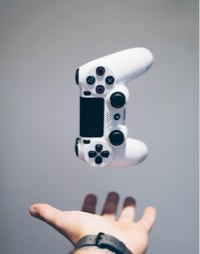 a console controller falls into a person's palm